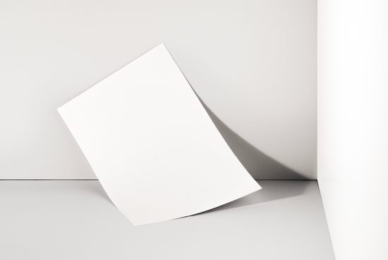 Blank white canvas mockup against a grey background with shadows, ideal for showcasing designs or templates for artists and graphic designers.